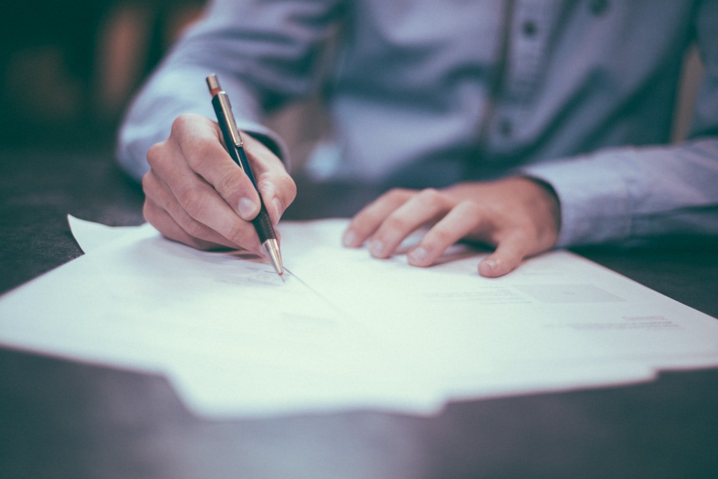 Legal documents being reviewed and signed